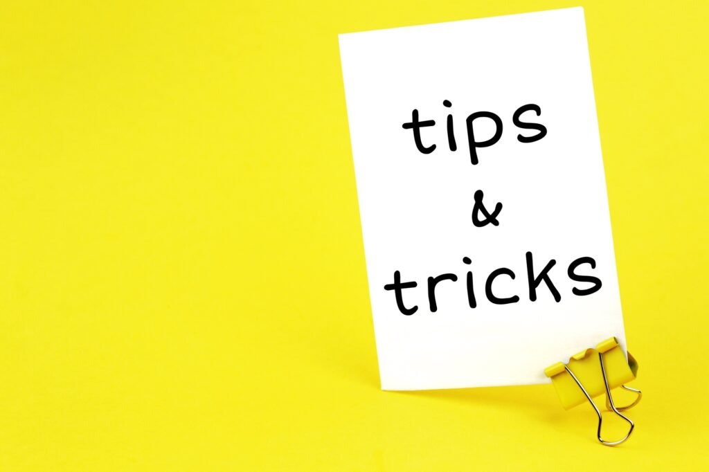 tips & tricks. Note written on a white sticker with paper clip.